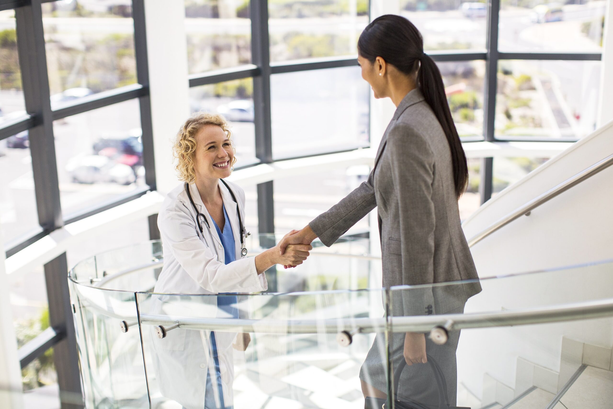 doctor and physician recruiter shaking hands