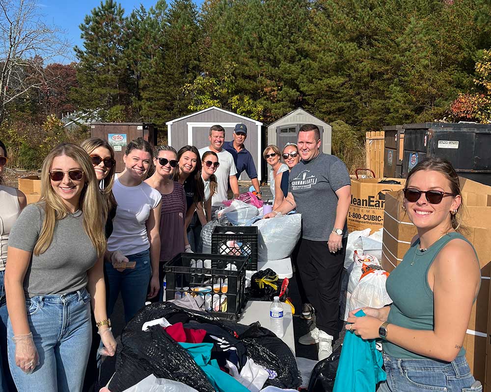 Group of diverse volunteers smiling and posing together