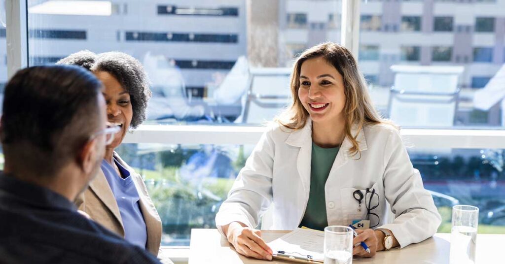 Female doctor speaking with hospital executives