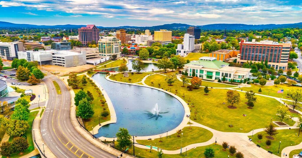 Downtown Huntsville aerial with Big Spring International Park and fountain in the foreground, during autumn.
