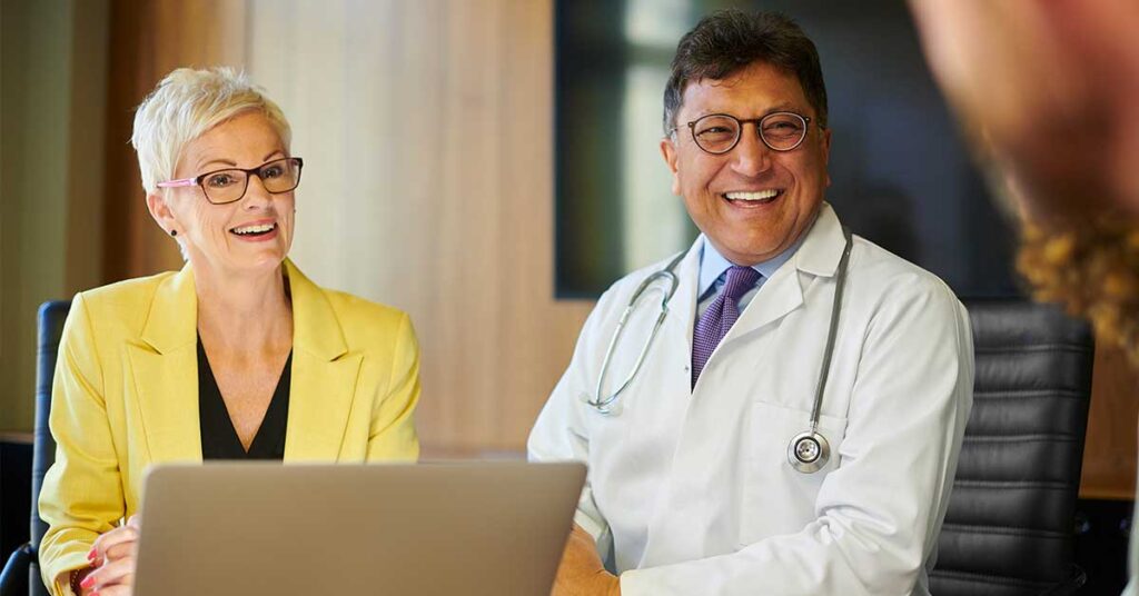 Male Physician Executive and Female Administrator