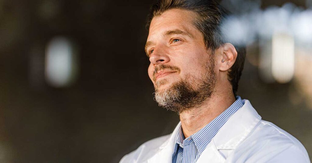 Male physician looking into distance