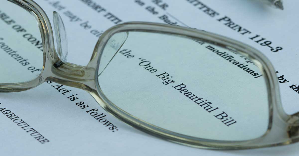 Eyeglasses magnifying the words "Big Beautiful Bill"