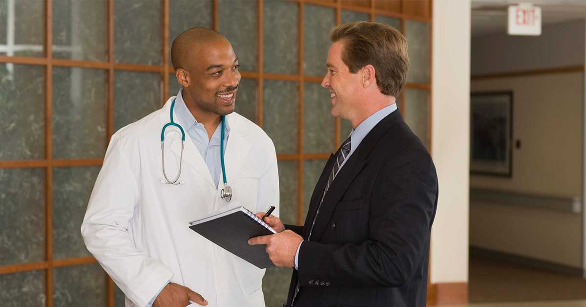 Doctor and businessman talking
