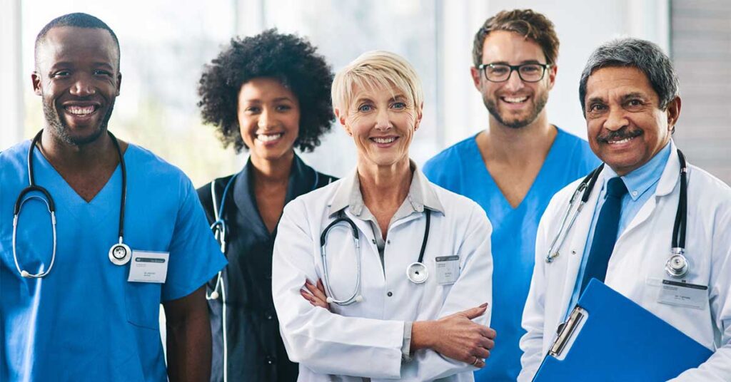Portrait of a diverse team of doctors standing together in a hospital