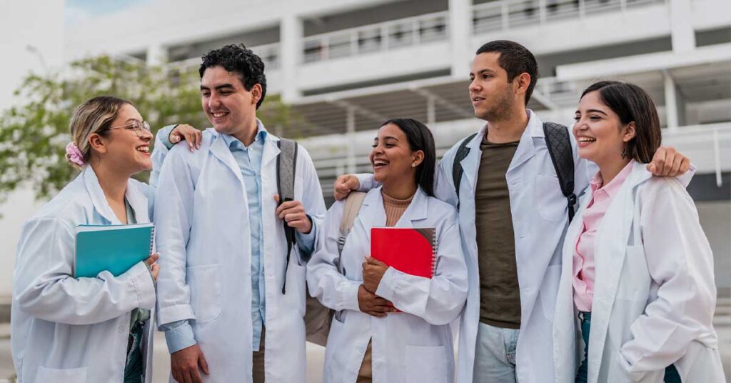 Young medical students friends talking outside the university