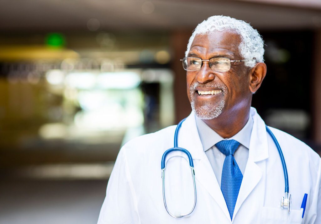 Portrait of a senior african american doctor at the hospital
