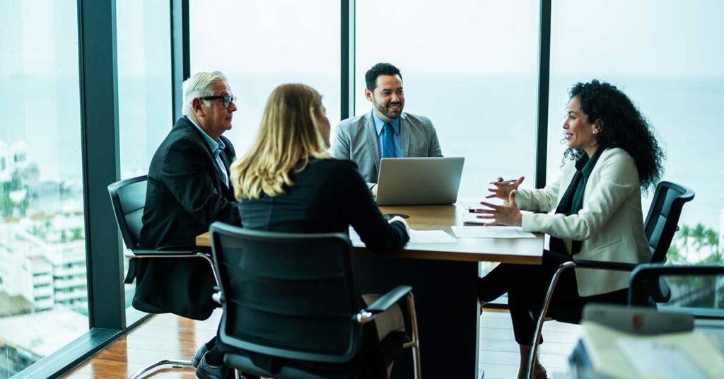 Coworkers talking on business meeting on office