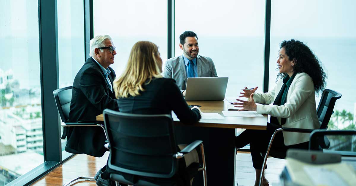 Coworkers talking on business meeting on office