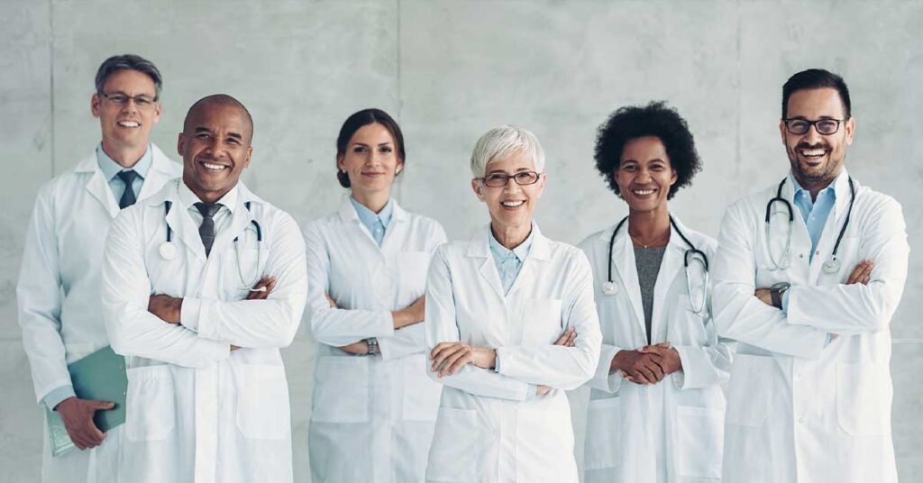 Multiracial group of confident smiling doctors