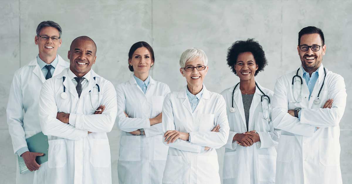 Multiracial group of confident smiling doctors