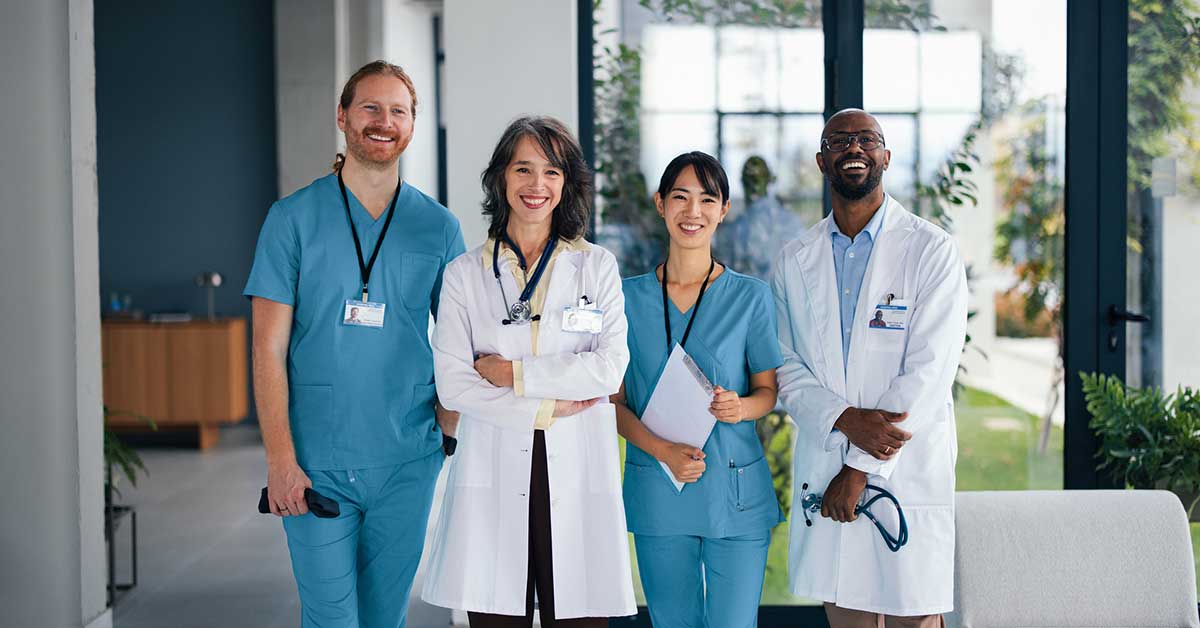 Diverse Medical Team Standing Together in a Modern Hospital Lobby